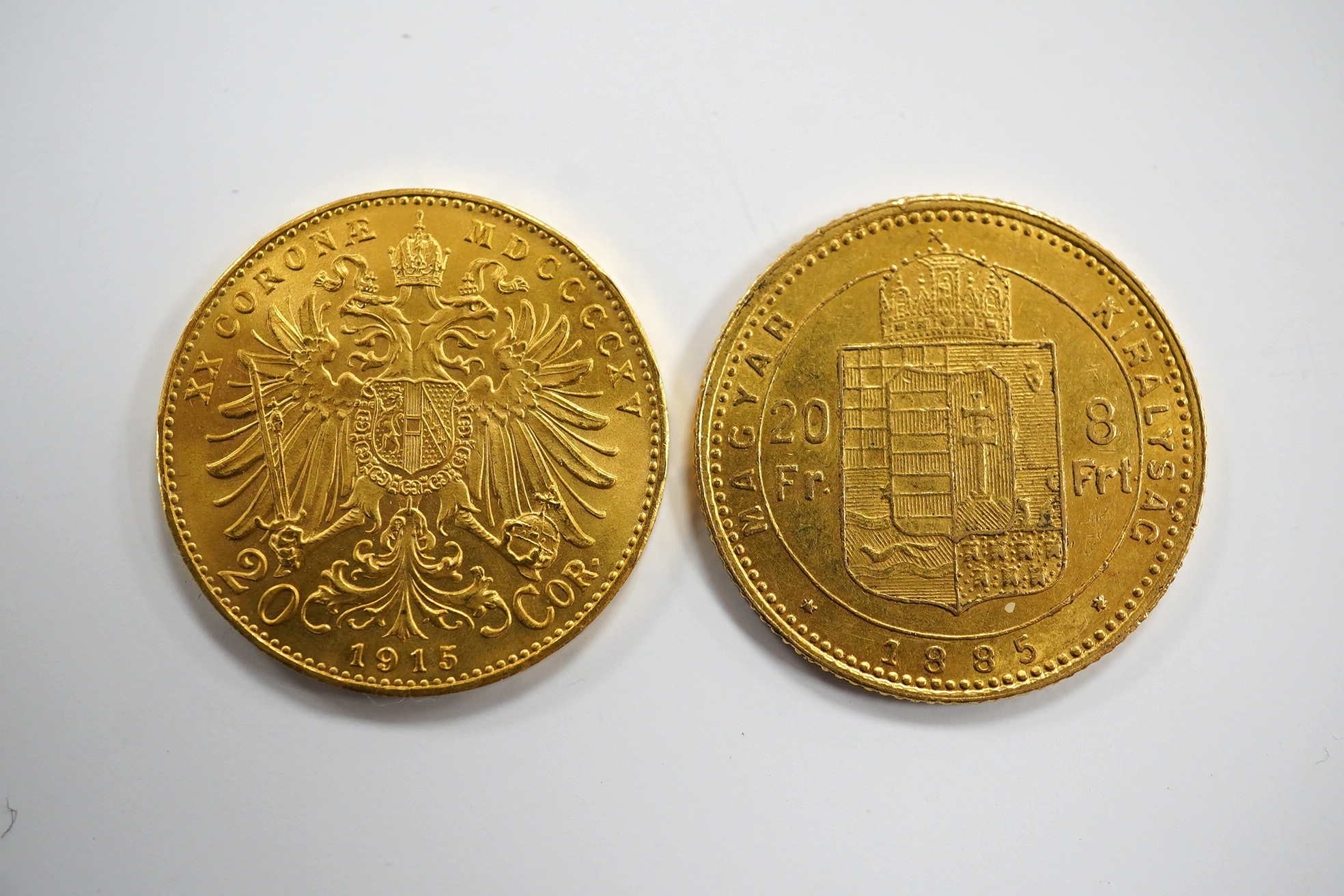 Hungary/Austrian Empire gold coins, Francis Joseph I, 20 francs / 8 forint, 1885 KB, about EF and 20 corona, 1915 re-strike, UNC